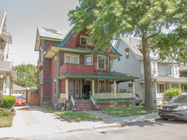 outside of two family home for sale at maltz auctions in new york