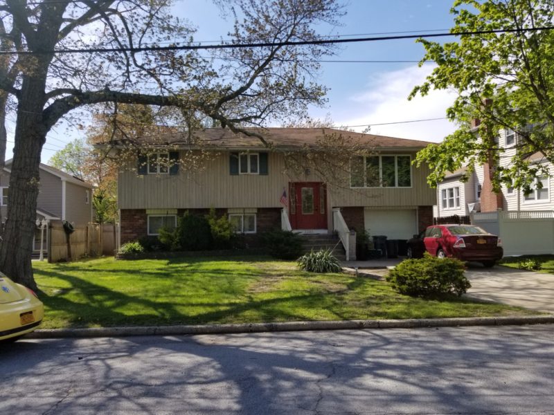 front of home up for private sale at Maltz Auctions