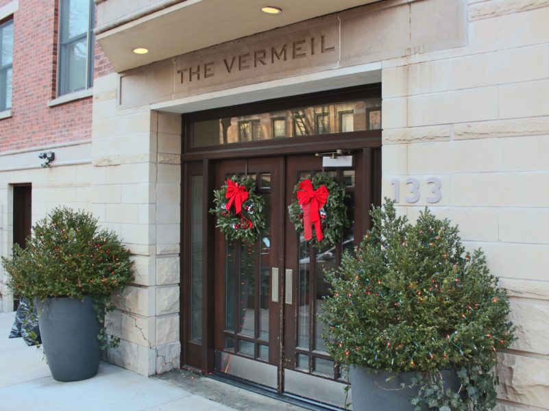 outside of luxury duplex condo front doors - building for sale by auction