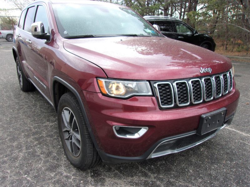 outside of red jeep automobile for sale by auto auction in new york city