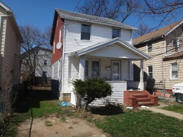 exterior of small home for sale by maltz auctions in new york city