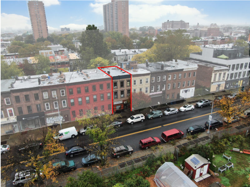 aerial view of exterior of mixed use building for sale by maltz auctions