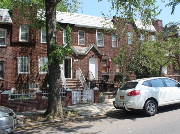 exterior of brick and slate home for sale at maltz auctions in new york