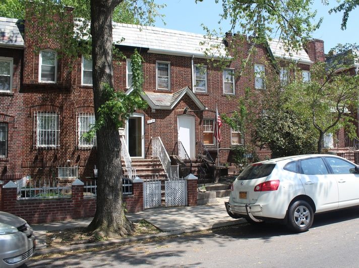 exterior of brick and slate home for sale at maltz auctions in new york