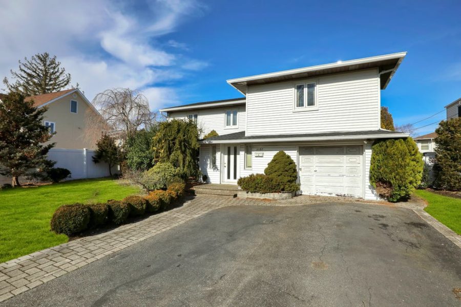 front exterior of home for sale at maltz auctions in new york