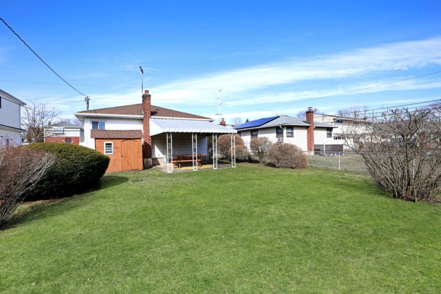 exterior backyard view of home for sale at maltz auctions in new york
