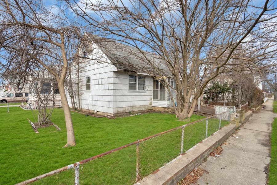 exterior side view of home for sale at maltz auctions in new york