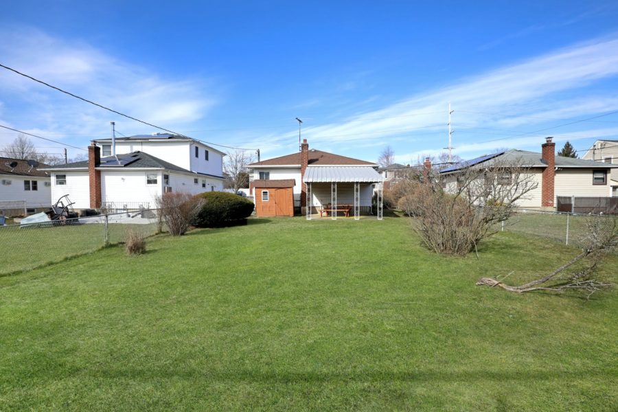 exterior backyard view of home for sale at maltz auctions in new york