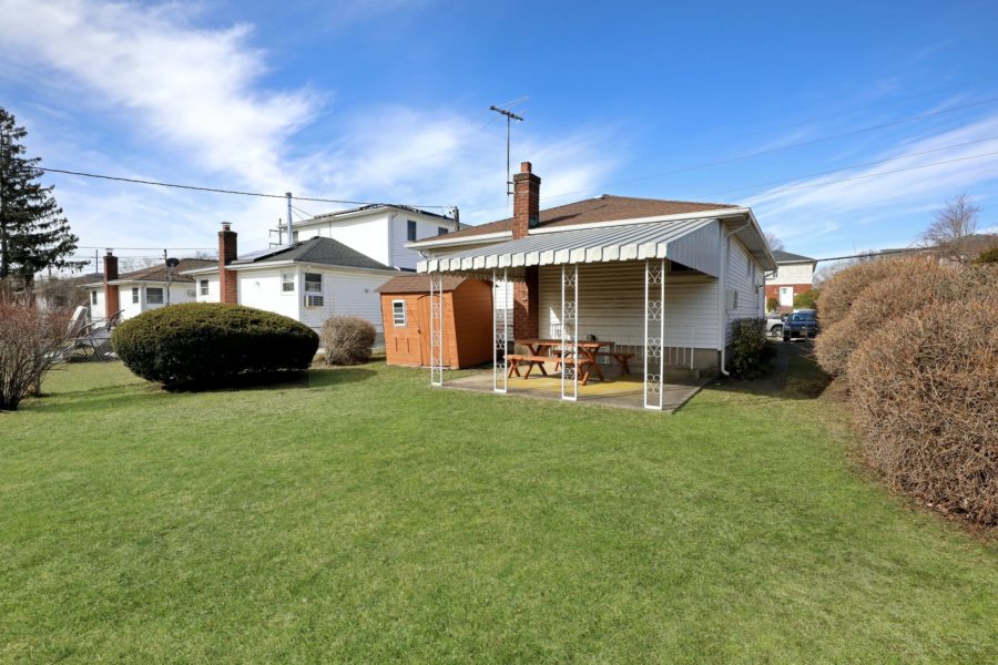 exterior backyard view of home for sale at maltz auctions in new york
