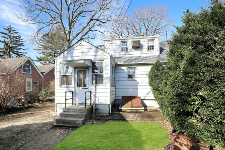 back exterior of home for sale at maltz auctions in new york