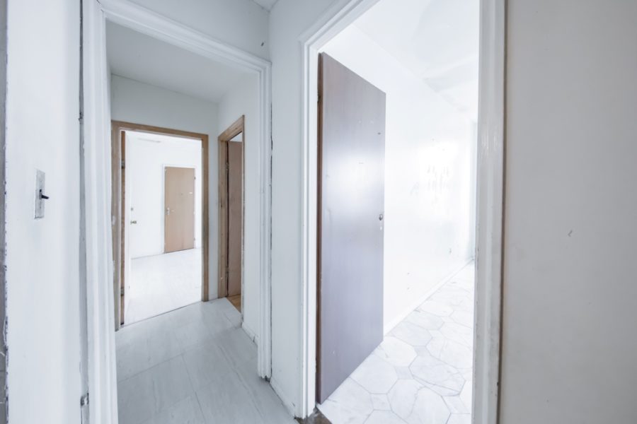 corridor of duplex condo for sale at maltz auctions in new york