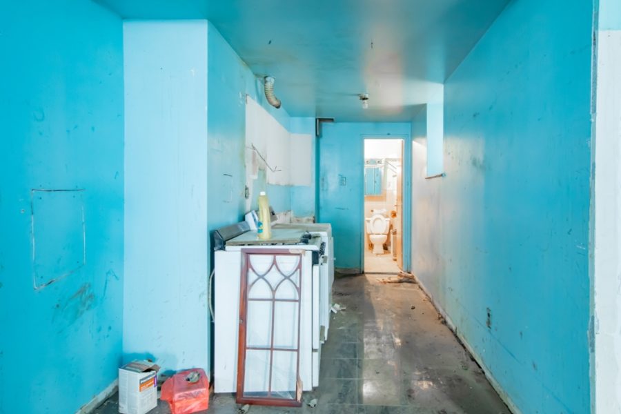 unfinished basement of duplex condo for sale at maltz auctions in new york
