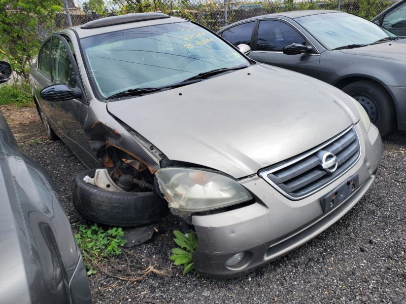 damaged tan vehicle for sale at maltz auto auctions in new york