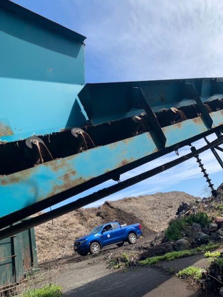 side of rusted construction equipment for sale by maltz auctions