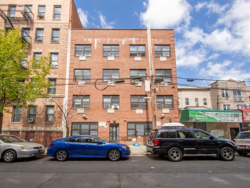 outside of 16 unit multifamily building for sale at maltz auctions