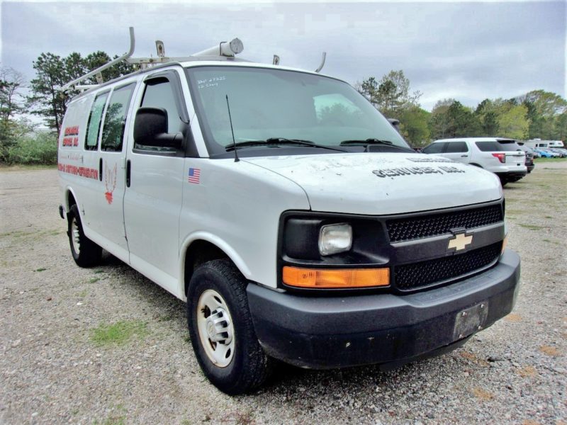 front of white van for sale at maltz auto auctions