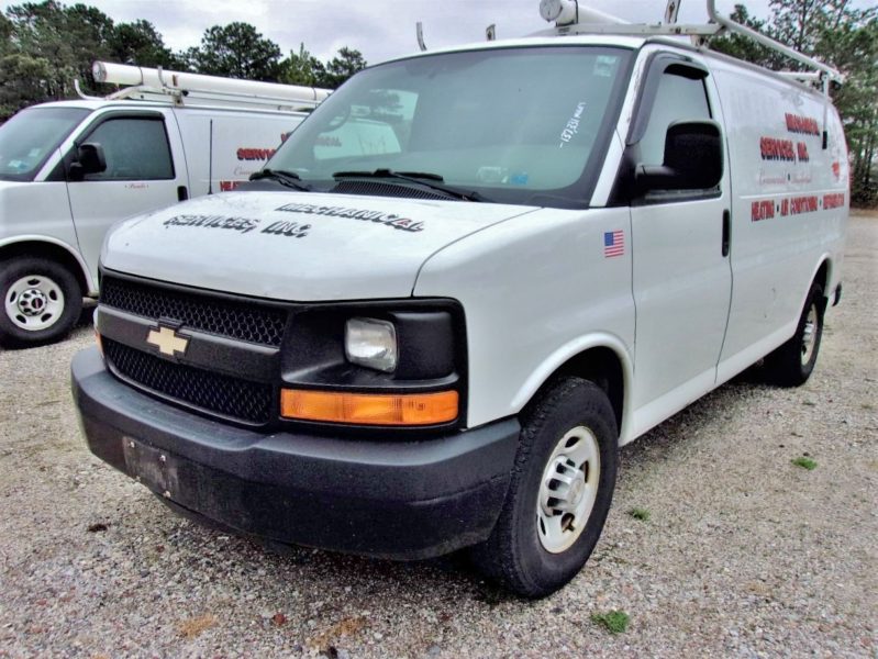 front of white van for sale at maltz auto auctions