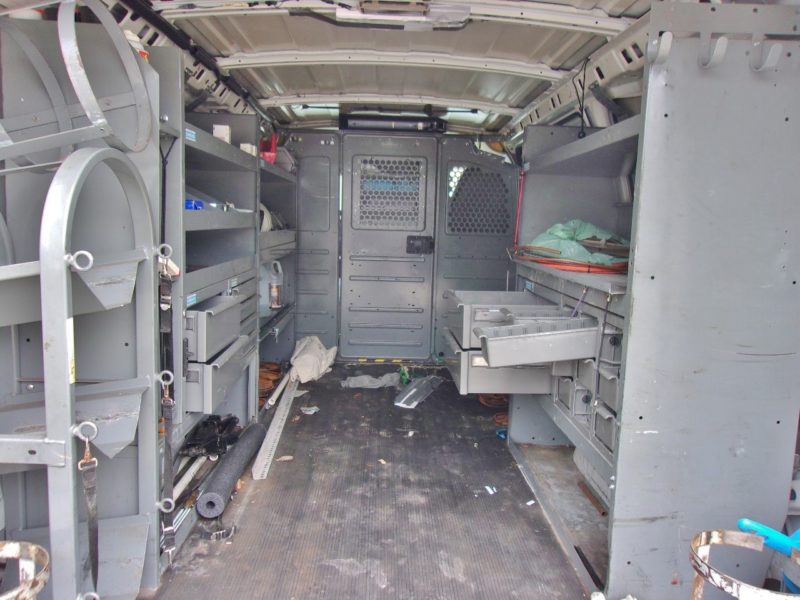 inside of white van for sale at maltz auto auctions