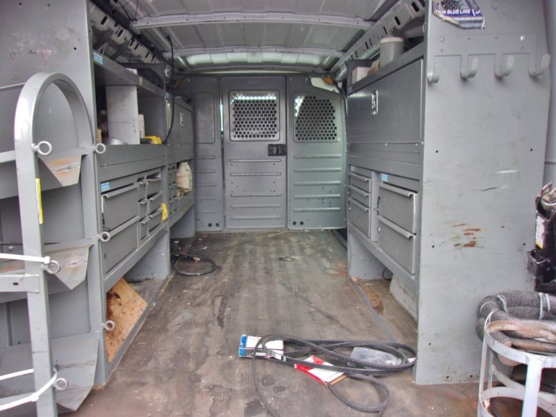 inside of white van for sale at maltz auto auctions