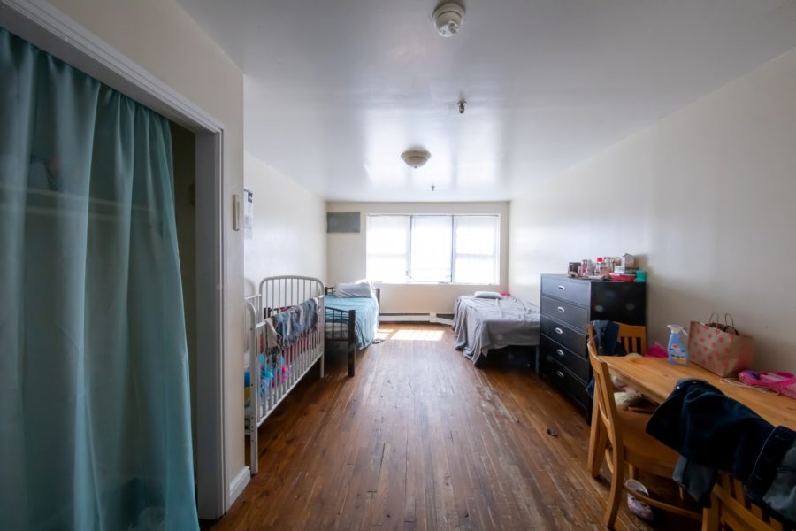 bedroom of 16 unit multifamily building for sale at maltz auctions