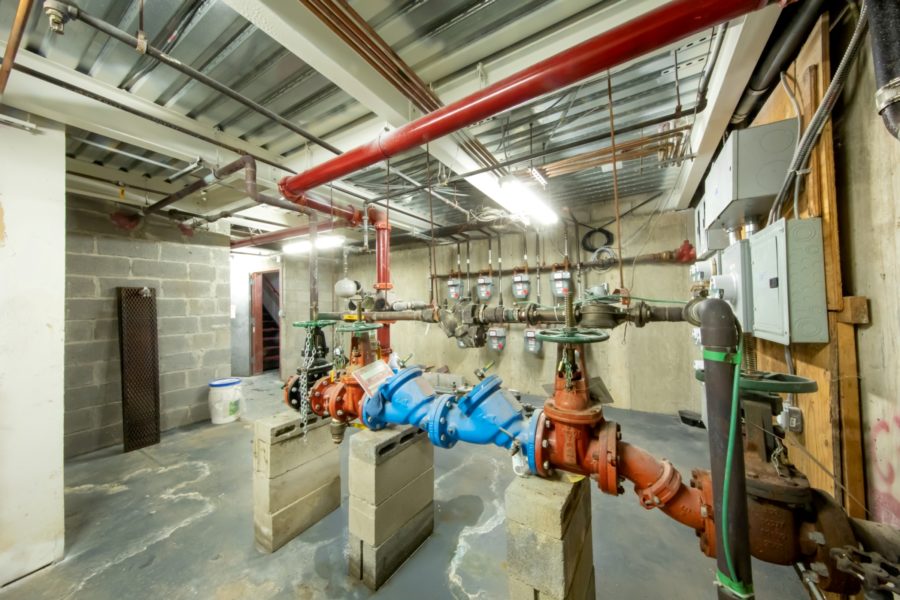 basement and plumbing of 16 unit multifamily building for sale at maltz auctions