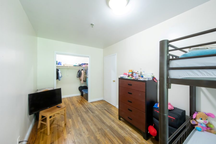 bedroom of 16 unit multifamily building for sale at maltz auctions