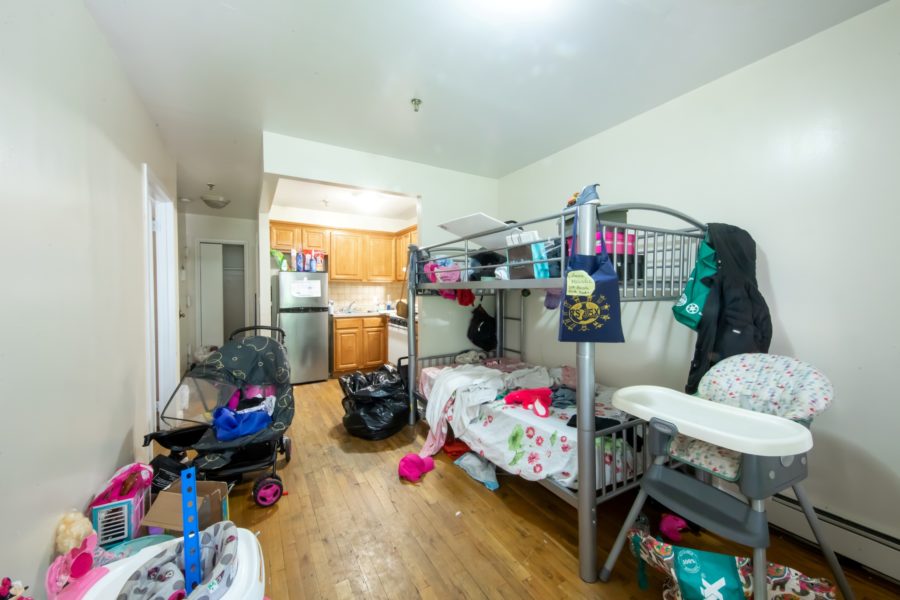 bedroom of 16 unit multifamily building for sale at maltz auctions