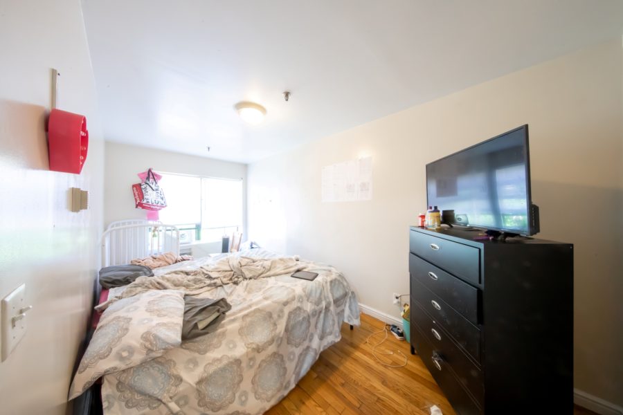 bedroom of 16 unit multifamily building for sale at maltz auctions