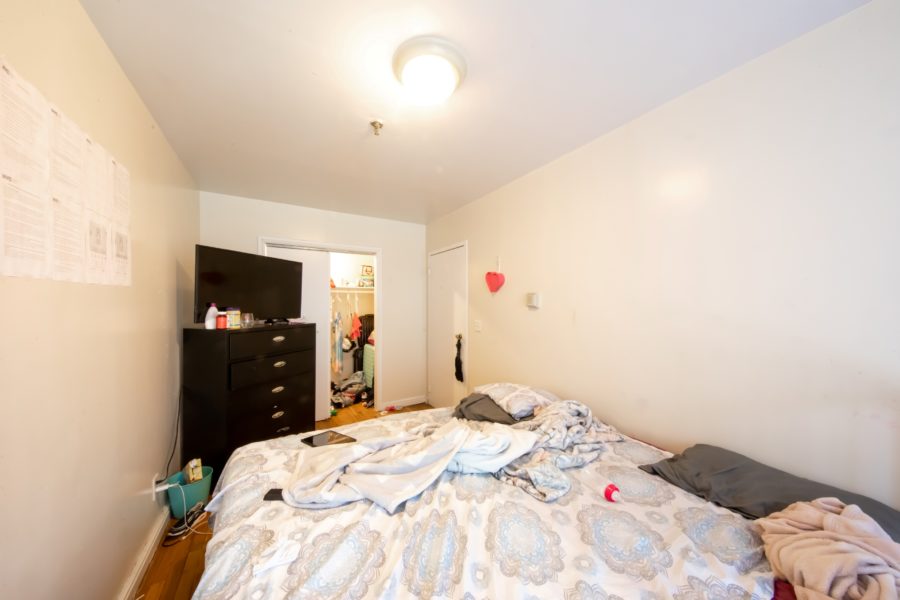 bedroom of 16 unit multifamily building for sale at maltz auctions