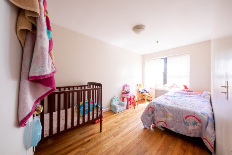 bedroom of 16 unit multifamily building for sale at maltz auctions