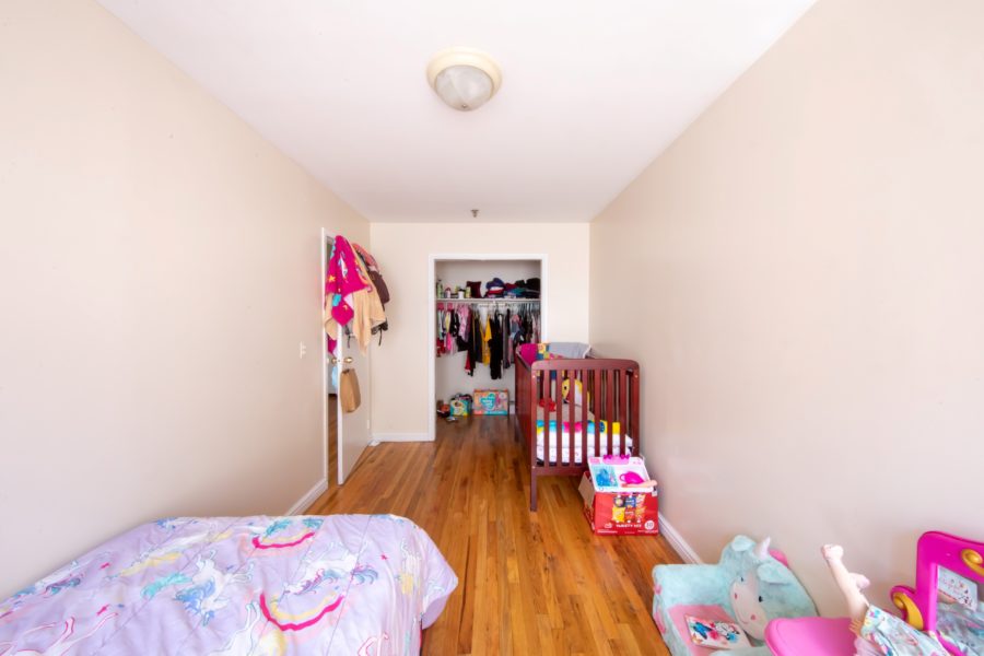 bedroom of 16 unit multifamily building for sale at maltz auctions