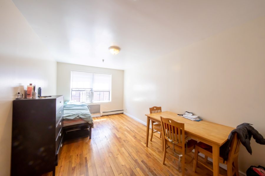 bedroom of 16 unit multifamily building for sale at maltz auctions