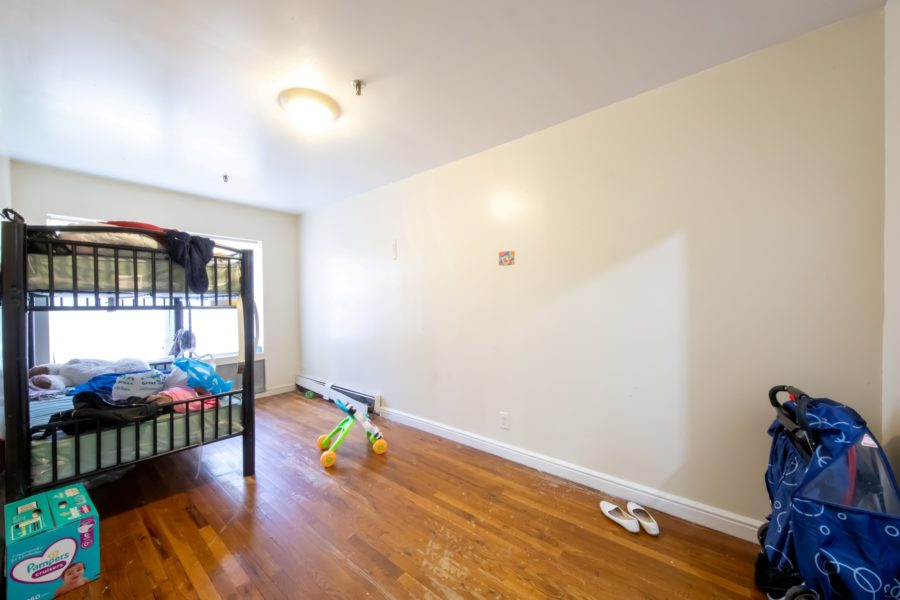 bedroom of 16-unit multifamily building for sale at maltz auctions in new york