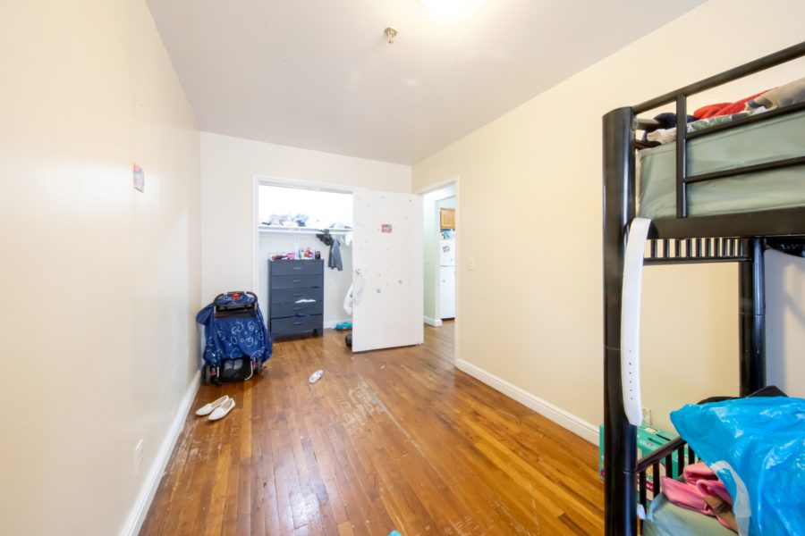 bedroom of 16-unit multifamily building for sale at maltz auctions in new york