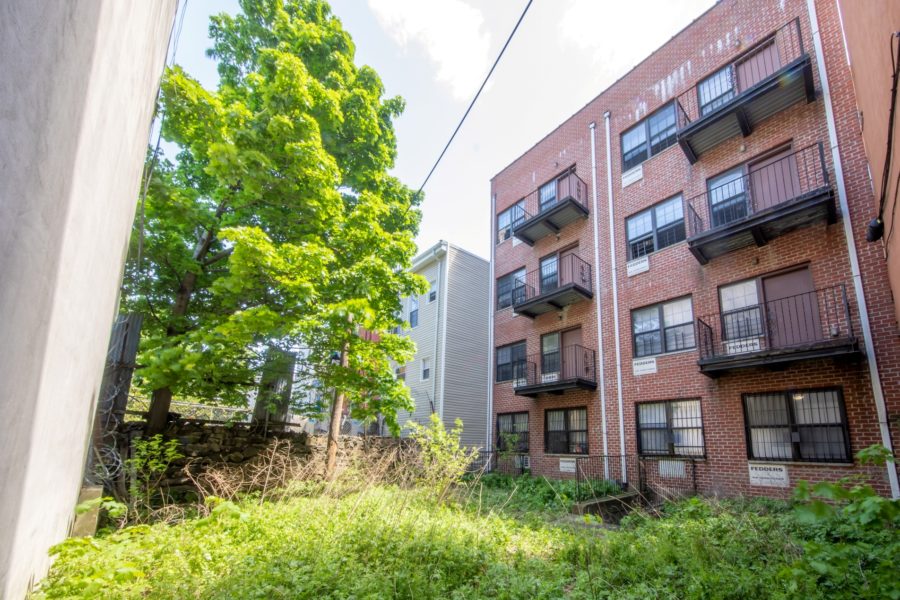 outside of 16-unit multifamily building for sale at maltz auctions in new york