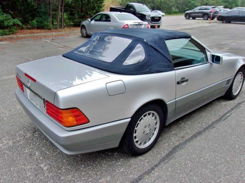 side of silver vehicle for sale at maltz automobile auctions