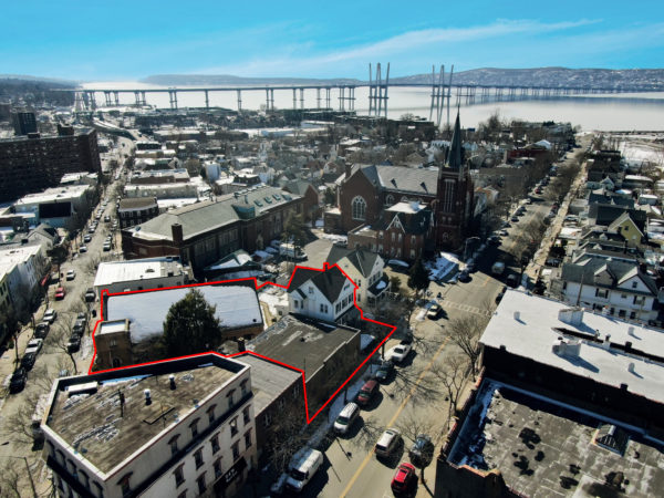 birds eye view of three buildings for sale at maltz auctions