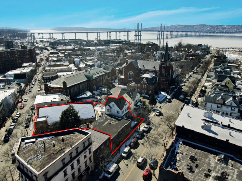 birds eye view of three buildings for sale at maltz auctions