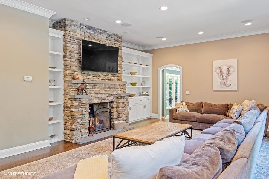 fireplace, mantel, and living are of 6 bedroom luxury home on 2 acres up for auction