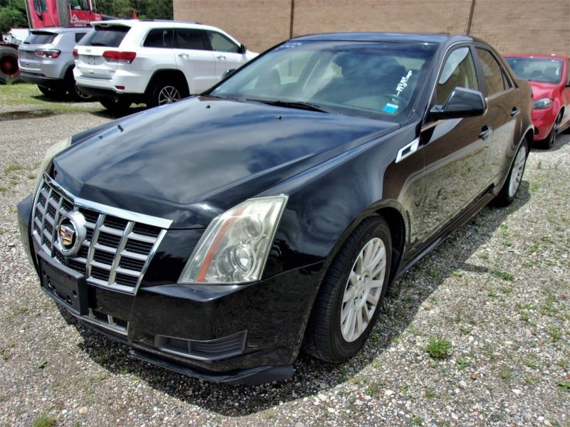 Front view of black automobile - buy at auction at Maltz Auctions