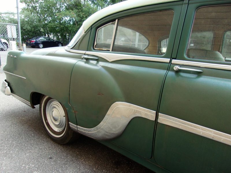 Close up view of right side of Pontiac doors at Maltz Auction