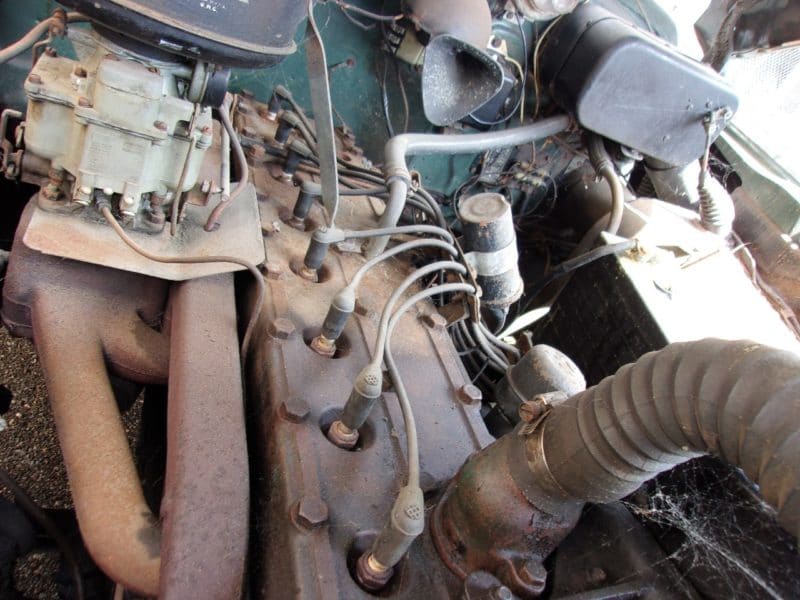 Side view of engine in classic Pontiac car up for auction in New York