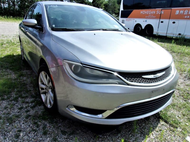 Front view of silver car - buy at auction at Maltz Auctions
