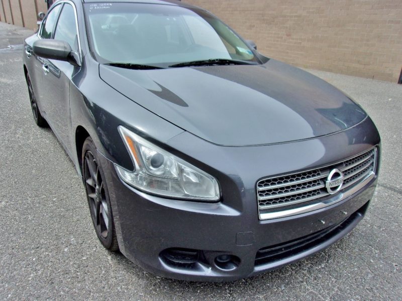 Front side of gray Nissan - find at an auction near you