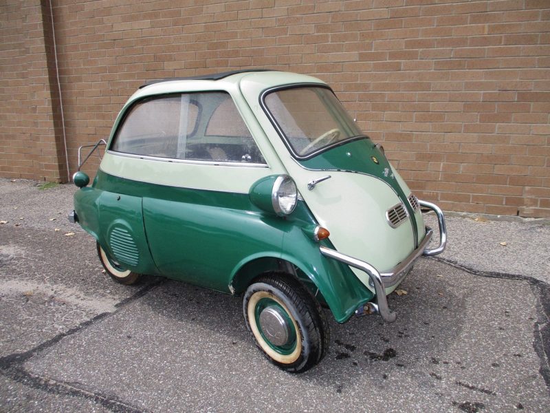 Angled front view of green and white vehicle up for auction at Maltz Auctions