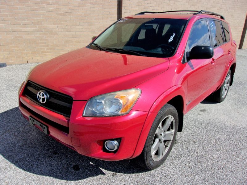 red automobile for sale at maltz auctions