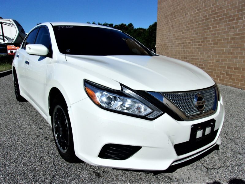 white nissan automobile for sale at maltz auctions