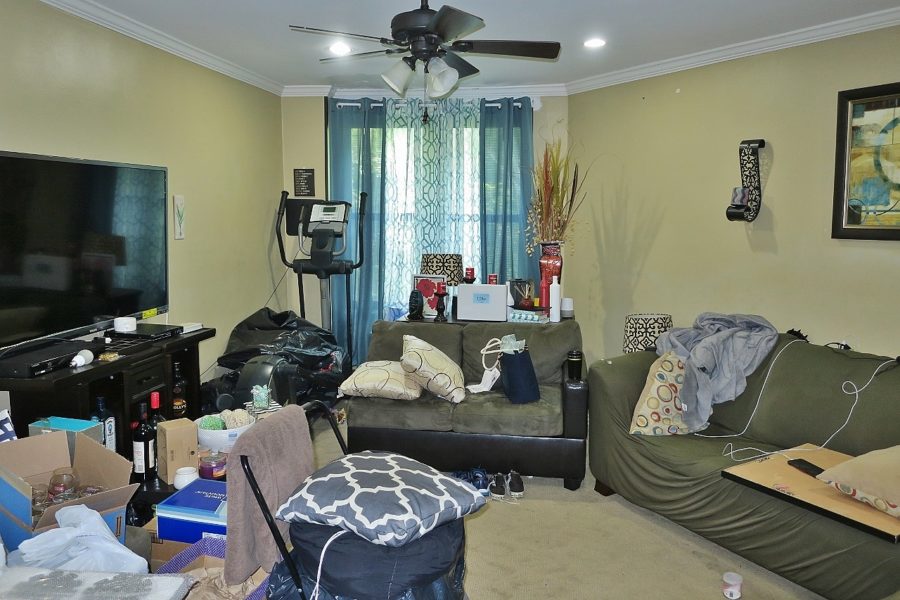 futon and window in living room of home up for sale at Maltz Auctions