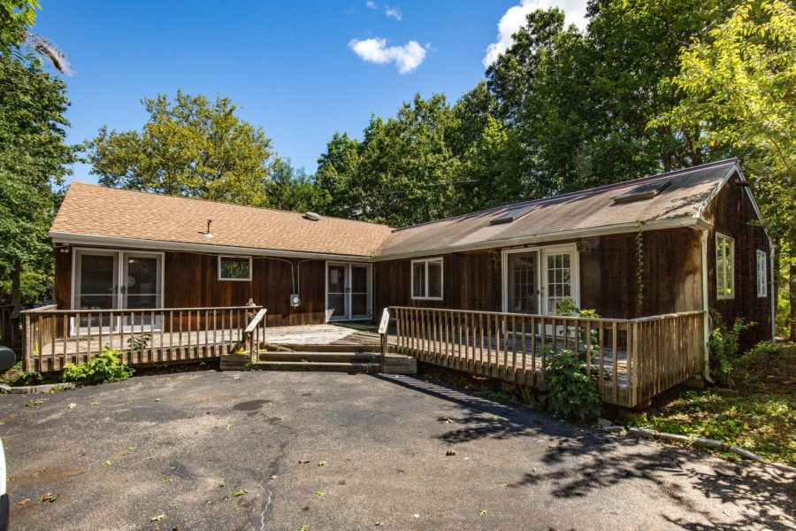 front of home up for sale at Maltz Auctions