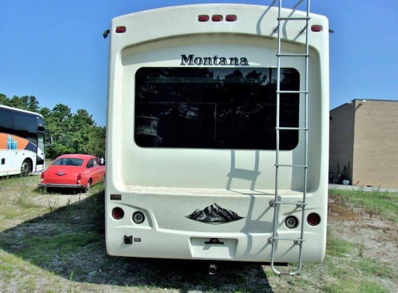 Backside of Montana camper automobile at Maltz Auctions, a property management company in New York